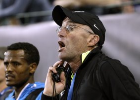Mentor: Former distance runner Alberto Salazar yells out lap times to distance runner Mo Farah during the 10,000-metre race in the Prefontaine Classic track and field meet in Eugene, Oregon last month.