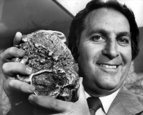 Ron Mulock, then NSW Minister for Mineral Resources, holding the largest gold nugget found in Australia.