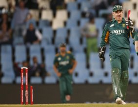 Snapped: South Africa's wicketkeeper Morne van Wyk holds a broken stump after teammate Dale Steyn took the wicket of New Zealand's Mitchell McClenaghan.