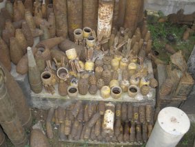 The devil's harvest: This large collection of unexploded ordinance, ranging from aerial bombs to artillery and mortar shells and hand grenades, were collected by disposal teams from the Mines Advisory Group in Laos. The yellow weapons are cluster bomblets.
