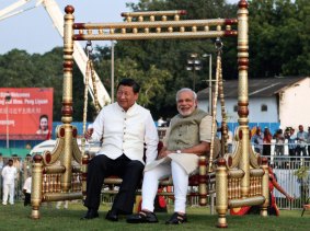 Chinese President Xi Jinping and Indian Prime Minister Narendra Modi sit on a traditional swing in India in September.