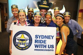 Giddy up: North Queensland CEO Greg Tonner, wearing his big blue Cowboys hat, with fans for the push to have Sydney supporters cheer for their team.