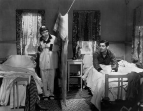 Claudette Colbert, left and Clark Gable in <i>It Happened One Night</i> (1934).
