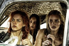 Three of the Five Wives, Riley Keough, left, as Capable, Courtney Eaton as Cheedo the Fragile, and Rosie Huntington-Whiteley as The Splendid Angharad.