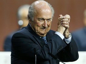 Staying put: FIFA President Sepp Blatter gestures as he is re-elected in Zurich.