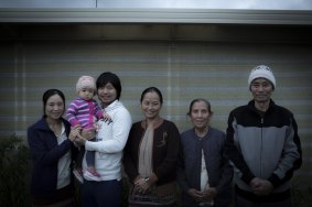 No fear: Mae Sie Win, second from left, and wife Myar and daughter Sophie, with his sister and parents at their home in Hoppers Crossing.