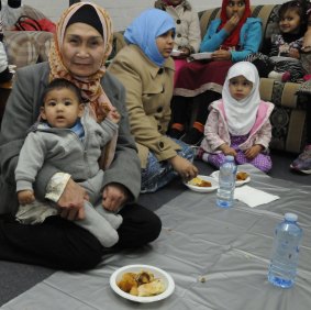 Celina Ciocon with 7-month-old grandson Abdurahman Durrani eating Iftar snacks.