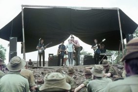 
Little Pattie on stage with Col Joye and The Joye Boys at Nui Dat, Vietnam, 1966.
