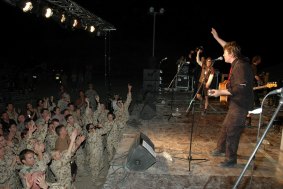 Doc Neeson entertains the troops at Camp Baghdad in Iraq as part of the Tour de Force concert, October, 2007.
