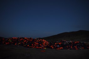 A mountain of discarded life jackets on the Greek island of Lesvos left by refugees after making the crossing from Turkey. 