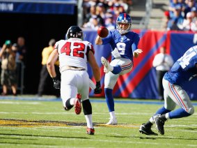 Making a name for hoimself: Brad Wing punts for the New York Giants against the Atlanta Falcons.