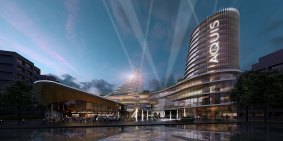 Aquis Development- A view of the rebuilt Casino Canberra standing with back to glebe Park and looking south with forecourt and watercourse at the entry and six-star hotel on left and five-star on right.