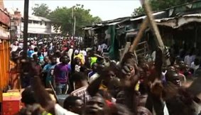 The aftermath: Footage from Nigeria's TVC News shows  chaos at the  market following the suicide attack.