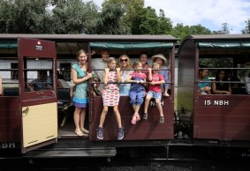 Michael Barnes (second from left) with his son-in-law Marshall Bown, daughters Kylie and Alinta, wife Trisha (hat) and three grand children, Asher 5, Aruna 8, Yani 11, on the Puffing Billy train. 