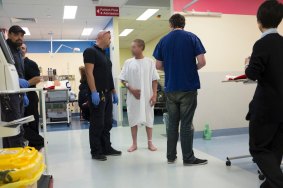 Security staff at Calvary Hospital talk to an intoxicated man. A national survey of 2000 emergency department staff found 92 per cent had been physically threatened by drunk patients, 98 per cent had been verbally abused and 88 per cent said the care of others had been negatively affected.