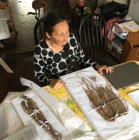 Patricia Landa, an archaeological conservator, painstakingly cleans and untangles the khipus at her house in Lima.