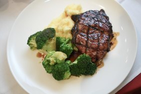 The porterhouse steak with mash, broccoli and red wine jus at Mario's in Fitzroy.