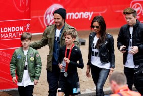 Romeo Beckham, centre, receives the support of his family, brother Cruz, left, parents David and Victoria and brother Brooklyn after taking part in the junior marathon during the London marathon on April 26. 