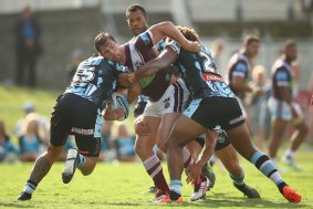 Comeback trail: Brenton Lawrence is tackled during last weekend's trial against Cronulla.