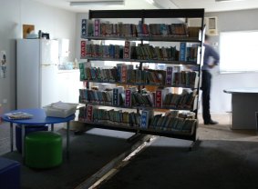 The library's books were saved after a gap opened between the two buildings, which were previously connected, allowing the water to gush out. 
