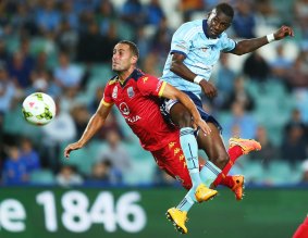 Defensive mindset: Sydney FC's Bernie Ibini tries to disrupt Adelaide's Tarek Elrich.