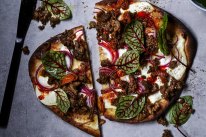 Spicy lamb naan pizza and Indian pickle.  