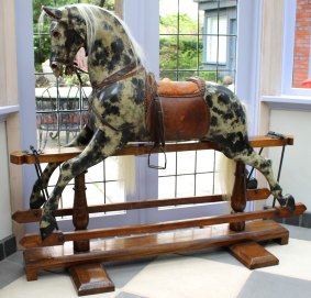 A rare English antique rocking horse with original leather saddle. Estimate $8000 to $12,000.