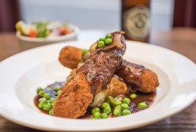 The crumbed sausages at the Drysdale Hotel.