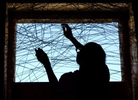 A work by Chiharu Shiota being installed  as part of the 2016 Biennale of Sydney. 