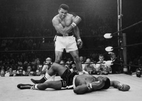 Iconic moment: Heavyweight champion Muhammad Ali stands over fallen challenger Sonny Liston, shouting and gesturing, shortly after dropping Liston with a short hard right to the jaw on May 25, 1965, in Lewiston, Maine.