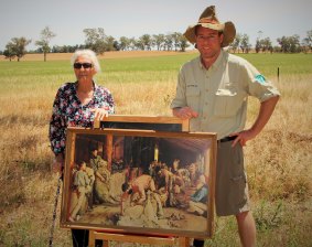 Dorothy Ambrose and Tim the Yowie Man outside the paddock near Corowa where the iconic "Shearing the Rams" was painted.