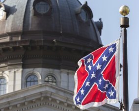 The Confederate battle flag flies on the grounds of the State House in Columbia, South Carolina, for the final time on July 10, 2015. 