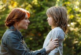 Bryce Dallas Howard is Grace and Oakes Fegley is Pete in Disney's Pete's Dragon, the adventure of an orphaned boy and his best friend Elliot, who just so happens to be a dragon. 