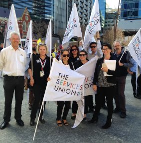 Members of the Queensland Services Union on strike on Wednesday.