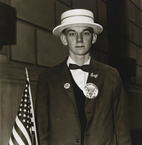 Diane Arbus, Boy with a straw hat waiting to march in a pro-war parade, NYC, 1967.