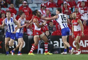 One last scuffle: Adam Goodes clashes with Scott Thompson.