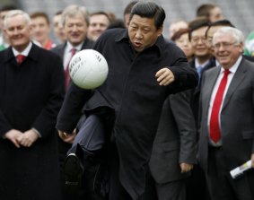 Football-loving nation: China's Vice-President Xi Jinping kicks a football during a visit to Croke Park in Dublin, Ireland.  