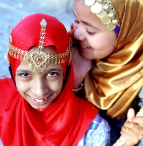 Girls dressed in traditional Omani clothes.