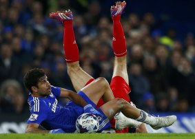 Upended: Steven Gerrard lands heavily in a Diego Costa tackle.