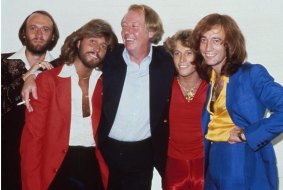 The Bee Gees with brother Andy Gibb and manager Robert Stigwood, New York, 1979, L-R Maurice Gibb, Barry Gibb, Maurice Stigwood, Andy Gibb, Robin Gibb. 