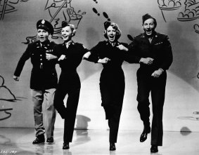 Singer Rosemary Clooney, second from right, dances with, from left to right, Bing Crosby, Vera-Ellen, and Danny Kaye in <i>White Christmas</i>.