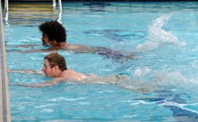Henry Speight (top) and David Pocock, swimming as part of their rehabilitation.