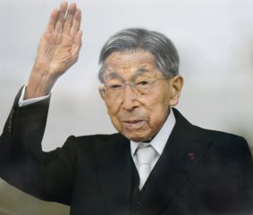 Japanese Prince Mikasa waves to well-wishers from a balcony during a New Year's public appearance at the Imperial Palace in Tokyo last year.