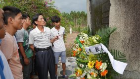 Local villagers taking a look at the war memorial.
