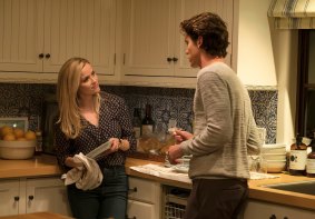 Reese Witherspoon, left, in a scene from Home Again.