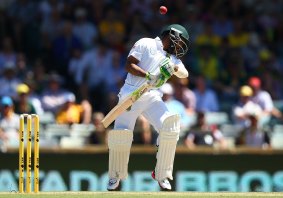Bavuma avoids a short pitched delivery from Mitchell Starc.
