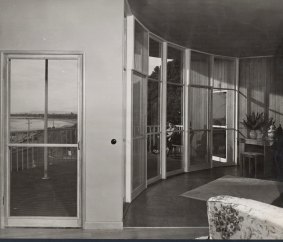 ''How do they get their furniture to fit?'' Interior of the round house, with its balcony overlooking the bay.