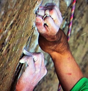 Kevin Jorgeson grips the surface of the Razor Edge during the climb.