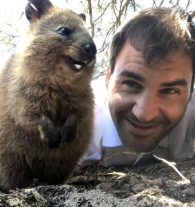 Roger Federer finds time to take a quokka selfie.