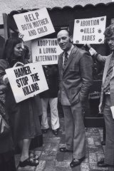 Protests outside the East Melbourne clinic have been going for decades. This photo, taken in 1976, shows Dr Bertram Wainer, who campaigned for the decriminalisation of abortion, surrounded by Right to Life protesters.